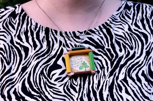 “Quiet Grace”: Small White Flower in Yellow and Green